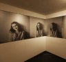 Portraits of Anne Frank in the introduction room.