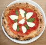Go-to dish: Buffalo mozzarella pizza with fresh basil and San Marzano tomatoes.