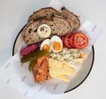 The Polish ploughman's plate includes ham, Kielbasa or house-cured salmon, pickle, egg, relish, vegetable salad and tomato.