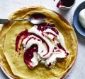 Swedish-style pancakes with jam and cream.