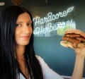 Shama Sukul Lee, the founder of Sunfed, with a burger made using her chicken free chicken product.