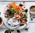 Coconut rice with quick pickled vegetables and prawn skewers.