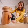 Nerida Thompson mills flour for her homemade bread.