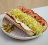 The deli hoagie with salami, ham, mustard pickle, provolone, tomato and iceberg lettuce.