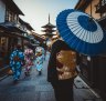 Kimono-clad women in downtown Kyoto.