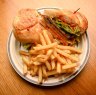 Steak sandwich with chutney and cheese (and chips).