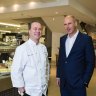 Celebrity chef Neil Perry (left) with David Jones CEO John Dixon: The department store's appetite for Australia's upmarket foodies could hurt Coles and Woolworths, credit agency Moody's warns.