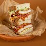 The schnitz comes with chicken schnitzel, white cabbage, pickled red onion, mayo, sticky sweet chilli, peanut chilli crack and shallots.
