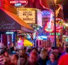 Lower Broadway, where country music rolls out of the neon-dipped honky tonks.