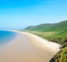 Rhossili Bay Beach, Gower Peninsula, Wales. A beautiful expanse of pristine sand often voted one of the world's best beaches, and popular for surfing. 