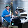 Lloyd Brothers winemaker Gonzalo Sanchez cooking a barbecue with a white wine spritzer in hand to keep cool.