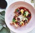 Grilled octopus with anchovy dressing, potatoes, onions and 'nduja oil.