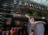No expense spared: Crowds who had lined up for more than six hours were treated to catering and entertainment ahead of Sephora's grand opening.