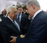 Israeli Prime Minister Benjamin Netanyahu shakes hands with Palestinian President Mahmoud Abbas Shimon Pere' funeral. 