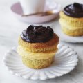 Boston cream cupcakes sandwiched with whipped coconut custard.