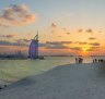 Burj Al Arab and Jumeirah Beach Hotel at sunset. 