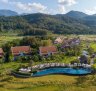 The semi-detached villas at the Pullman Luang Prabang, in Laos, are spread among working rice paddies.
