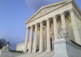People stand on the steps of the Supreme Court at sunset after the US Marshals Service confirmed that Justice Antonin Scalia died at the age of 79. 