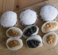 A set of mixed mochi, round and spongy rice desserts.