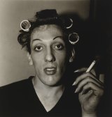 Diane Arbus, A young man in curlers at home on West 20th Street, NYC. 1966.
