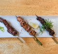 Trio of yakitori (chicken skewers).