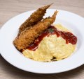 Omurice with tempura, tomato sauce and melted cheese.