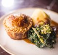 Beef and Guinness pie with buttered cabbage and silverbeet and mashed potato ticks all the pie boxes.