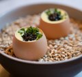 Snacks might include a soft-boiled egg with cream corn and caviar.