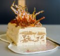 Caramel and ginger biscuit ice-cream cake topped with spiced toffee shards.