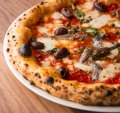 The classic napoletana carries no more than tomato, fior di latte, capers, olives and anchovies.
