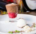 The chocolate mousse is sweet and light with a layer of raspberry at the base.