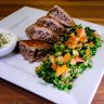 Kibbeh sagiah (spiced lamb kibbeh) with tabbouleh.