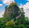 Mount Popa, Myanmar, beckons ... but the hike to the monastery is no easy stroll.