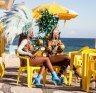 Samba dancers taking a break, Ipanema Beach, Rio De Janeiro, Brazil.