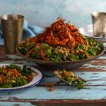 Toasted freekeh salad topped with crispy carrot.