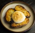 Royal blue potatoes topped with a cloud of mustard foam.