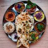 The vibrant thali tray of curries is just one course of the tasting menu. 