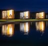 The lakeside "villas" are, in reality, glorified shipping-container-like cabins starting at a generously-sized 52.3 metres. 