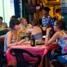 Customers at a restaurant on Sisowath Quay.