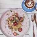 Crumpets with lemon butter, macerated strawberries and  lemon balm at Lorna Cafe, Ferntree Gully.