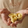 Katrina Pizzini displays some Italian delicacies.
