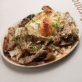 Chicken chilaquiles (breakfast nachos) should cure your hangover.