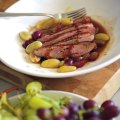 Grilled duck breast with grapes.