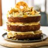 Sunshine on a plate: Hummingbird cake stacked with lemon curd and cream cheese icing, and topped with golden-hued decorations if you're feeling 'extra'.