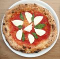 Go-to dish: Buffalo mozzarella pizza with fresh basil and San Marzano tomatoes.