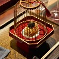 "Sea treasure" ball presented in a wooden birdcage.