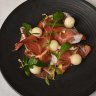 Black pig prosciutto with Christmas melon.