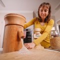 Nerida Thompson mills flour for her homemade bread.