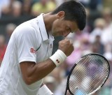 Djokovic celebrates a point against Federer.