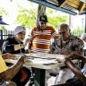 Locals playing a board game in Little Havana, Miami.